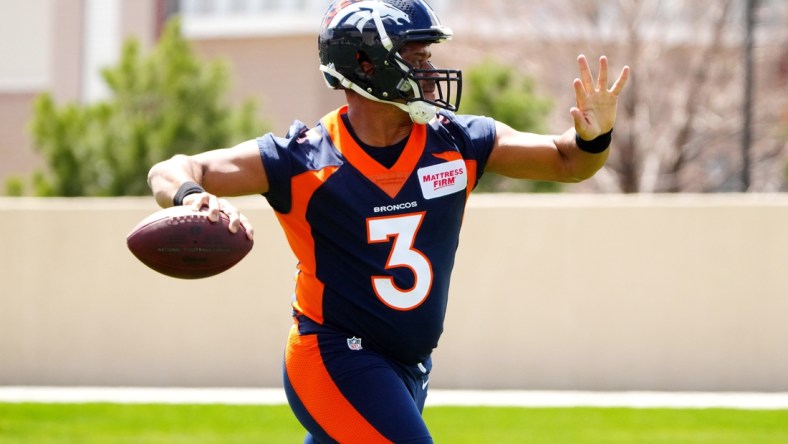 Apr 25, 2022; Englewood, CO, USA; Denver Broncos quarterback Russell Wilson (3) works out during a Denver Broncos mini camp at UCHealth Training Center. Mandatory Credit: Ron Chenoy-USA TODAY Sports