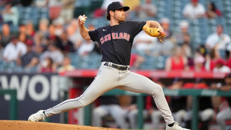 Apr 25, 2022; Anaheim, California, USA; Cleveland Guardians starting pitcher Shane Bieber (57) delivers a pitch in the second inning against the Los Angeles Angels at Angel Stadium. Mandatory Credit: Kirby Lee-USA TODAY Sports