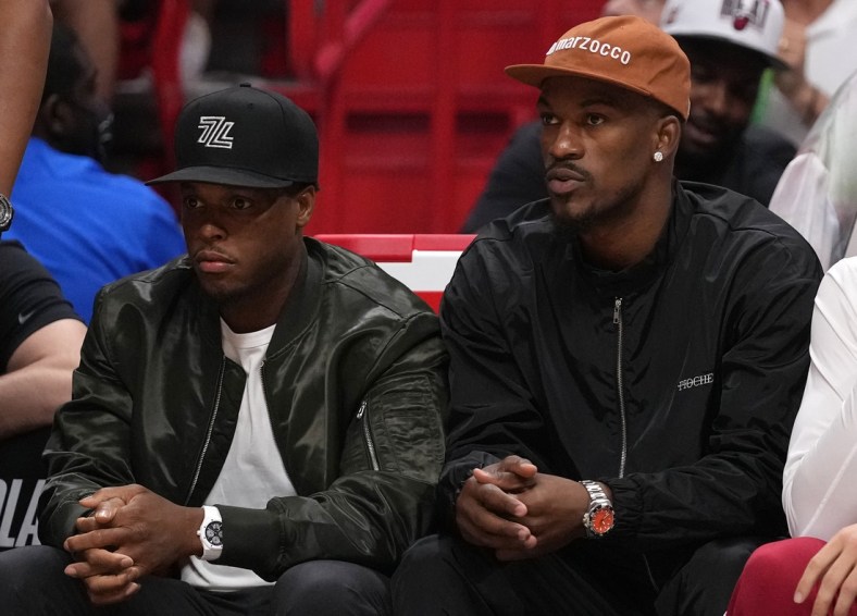 Apr 26, 2022; Miami, Florida, USA; Miami Heat guard Kyle Lowry (L) and Miami Heat forward Jimmy Butler (R) sit on the bench during the first half in game five of the first round for the 2022 NBA playoffs against the Atlanta Hawks at FTX Arena. Mandatory Credit: Jasen Vinlove-USA TODAY Sports