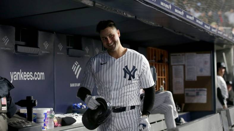 Apr 26, 2022; Bronx, New York, USA; New York Yankees left fielder Joey Gallo (13) smiles as he is ignored by teammates in the dugout after hitting a solo home run against the Baltimore Orioles during the fourth inning at Yankee Stadium. Mandatory Credit: Brad Penner-USA TODAY Sports