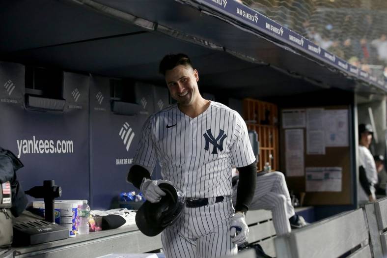 Apr 26, 2022; Bronx, New York, USA; New York Yankees left fielder Joey Gallo (13) smiles as he is ignored by teammates in the dugout after hitting a solo home run against the Baltimore Orioles during the fourth inning at Yankee Stadium. Mandatory Credit: Brad Penner-USA TODAY Sports