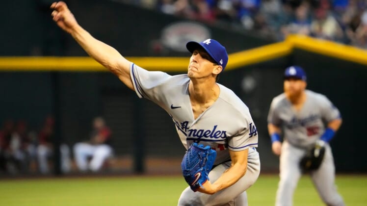 Apr 25, 2022; Phoenix, Arizona, USA; Los Angeles Dodgers starting pitcher Walker Buehler (21) throws to the Arizona Diamondbacks in the first inning at Chase Field.Mlb Los Angeles Dodgers At Arizona Diamondbacks