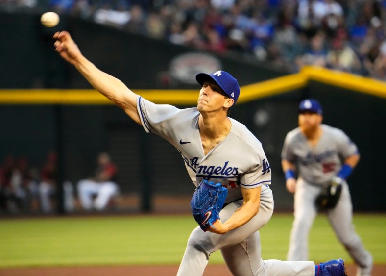 Apr 25, 2022; Phoenix, Arizona, USA; Los Angeles Dodgers starting pitcher Walker Buehler (21) throws to the Arizona Diamondbacks in the first inning at Chase Field.

Mlb Los Angeles Dodgers At Arizona Diamondbacks