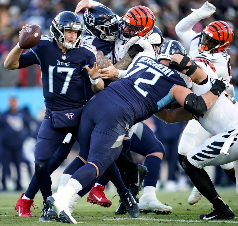 Tennessee Titans quarterback Ryan Tannehill (17) evades Cincinnati Bengals defenders during the first quarter of an AFC Divisional playoff game at Nissan Stadium Saturday, Jan. 22, 2022 in Nashville, Tenn.

Titans Bengals 012222 An 009
