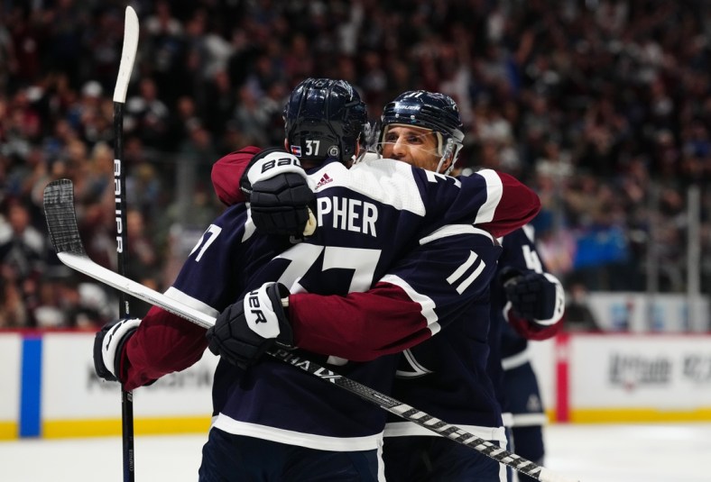Apr 28, 2022; Denver, Colorado, USA; Colorado Avalanche left wing J.T. Compher (37) celebrates his goal with center Andrew Cogliano (11) in the second period against the Nashville Predators at Ball Arena. Mandatory Credit: Ron Chenoy-USA TODAY Sports
