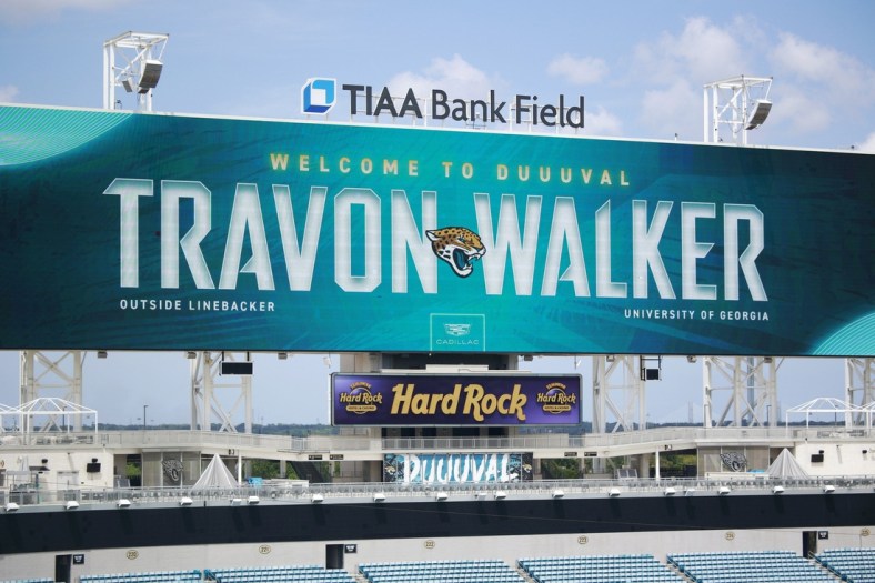 The scoreboard welcomes Jacksonville Jaguars first round draft pick Travon Walker after a press conference Friday, April 29, 2022 at TIAA Bank Field in Jacksonville. Walker, a defensive lineman from the University of Georgia, was the overall No. 1 pick for the Jacksonville Jaguars in the 2022 NFL Draft. [Corey Perrine/Florida Times-Union]

Jki 043022 No 1