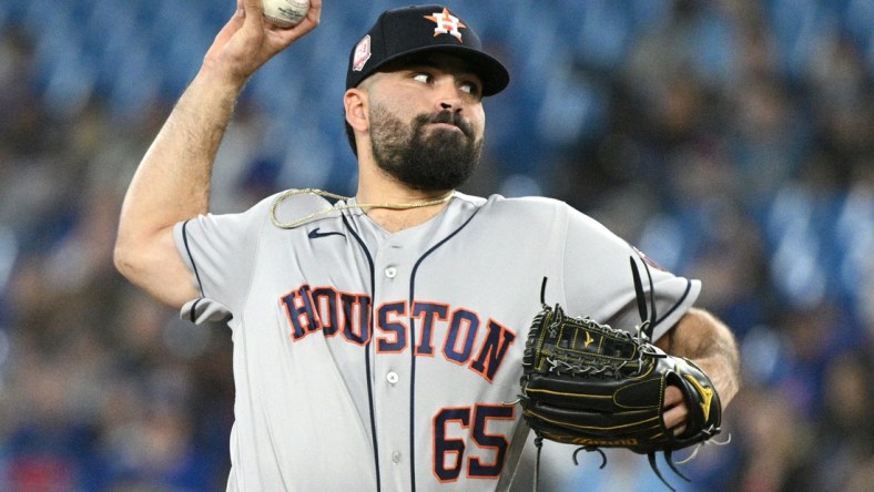 Apr 29, 2022; Toronto, Ontario, CAN;  Houston Astros starting pitcher Jose Urquidy (65) delivers a pitch against the Toronto Blue Jays in the first inning at Rogers Centre. Mandatory Credit: Dan Hamilton-USA TODAY Sports