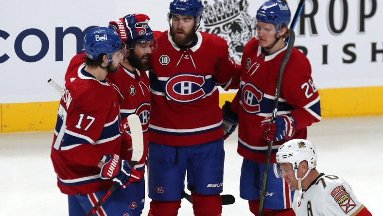 Apr 29, 2022; Montreal, Quebec, CAN; Montreal Canadiens center Mathieu Perreault (85) celebrates his goal against Florida Panthers with teammates during the second period at Bell Centre. Mandatory Credit: Jean-Yves Ahern-USA TODAY Sports