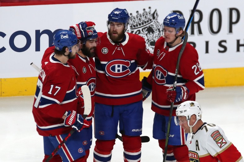 Apr 29, 2022; Montreal, Quebec, CAN; Montreal Canadiens center Mathieu Perreault (85) celebrates his goal against Florida Panthers with teammates during the second period at Bell Centre. Mandatory Credit: Jean-Yves Ahern-USA TODAY Sports