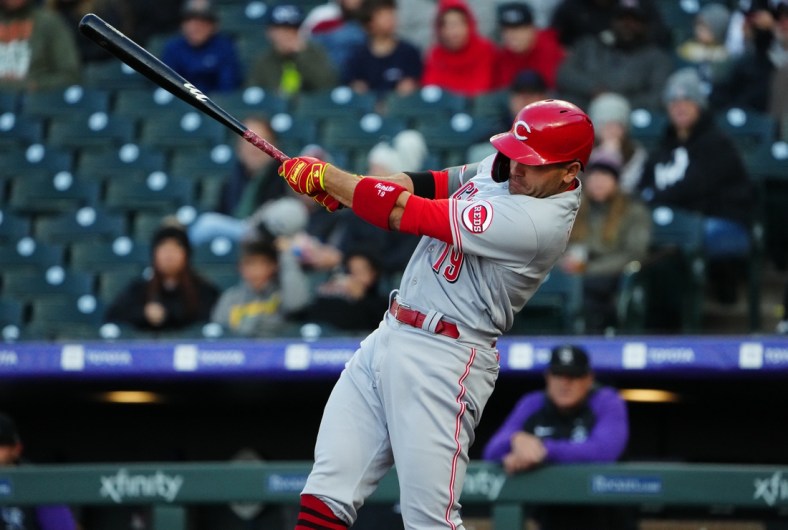 Apr 29, 2022; Denver, Colorado, USA; Cincinnati Reds first baseman Joey Votto (19) swings in the first inning against the Colorado Rockies at Coors Field. Mandatory Credit: Ron Chenoy-USA TODAY Sports