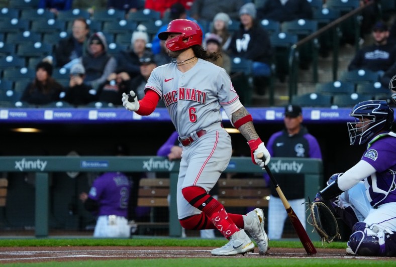 Apr 29, 2022; Denver, Colorado, USA; Cincinnati Reds second baseman Jonathan India (6) singles in the first inning against the Colorado Rockies at Coors Field. Mandatory Credit: Ron Chenoy-USA TODAY Sports