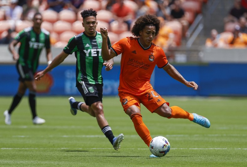 Apr 30, 2022; Houston, Texas, USA; Houston Dynamo FC midfielder Adalberto Carrasquilla (20) passes the ball during the first half against the Austin FC at PNC Stadium. Mandatory Credit: Troy Taormina-USA TODAY Sports