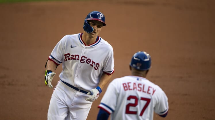 Apr 30, 2022; Arlington, Texas, USA; Texas Rangers shortstop Corey Seager (5) rounds the bases after he hits a home run against the Atlanta Braves during the first inning at Globe Life Field. Mandatory Credit: Jerome Miron-USA TODAY Sports