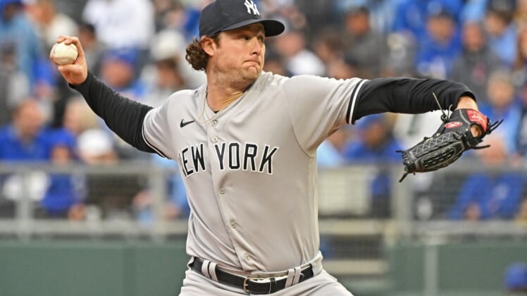 Apr 30, 2022; Kansas City, Missouri, USA;  New York Yankees starting pitcher Gerrit Cole (45) delivers a pitch during the first inning against the Kansas City Royals at Kauffman Stadium. Mandatory Credit: Peter Aiken-USA TODAY Sports