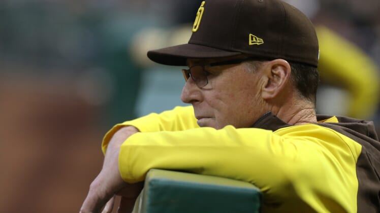 Apr 30, 2022; Pittsburgh, Pennsylvania, USA;  San Diego Padres manager Bob Melvin (3) looks on over he dugout rail against the Pittsburgh Pirates during the fourth inning at PNC Park. Mandatory Credit: Charles LeClaire-USA TODAY Sports