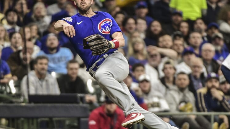 Apr 30, 2022; Milwaukee, Wisconsin, USA;  Chicago Cubs third baseman Patrick Wisdom (16) is unable to retire Milwaukee Brewers right fielder Hunter Renfroe (not pictured) who reaches on an infield hit in the fifth inning at American Family Field. Mandatory Credit: Benny Sieu-USA TODAY Sports