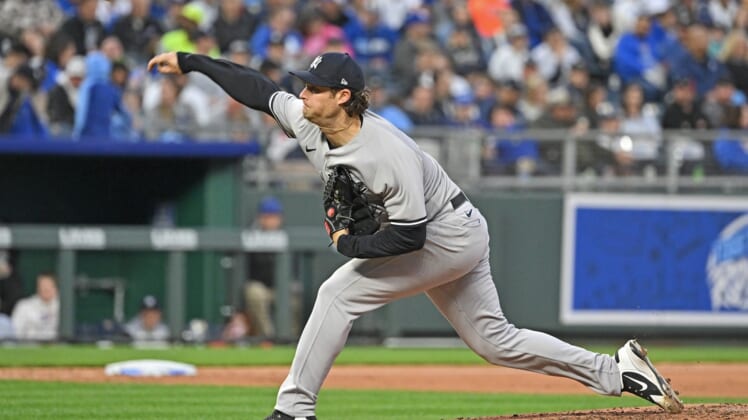 Apr 30, 2022; Kansas City, Missouri, USA;  New York Yankees starting pitcher Gerrit Cole (45) delivers a pitch during the fourth inning against the Kansas City Royals at Kauffman Stadium. Mandatory Credit: Peter Aiken-USA TODAY Sports