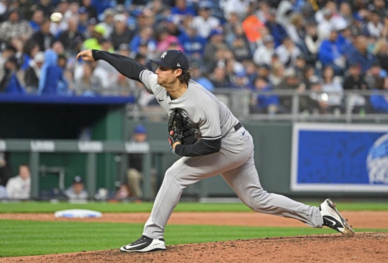 Apr 30, 2022; Kansas City, Missouri, USA;  New York Yankees starting pitcher Gerrit Cole (45) delivers a pitch during the fourth inning against the Kansas City Royals at Kauffman Stadium. Mandatory Credit: Peter Aiken-USA TODAY Sports