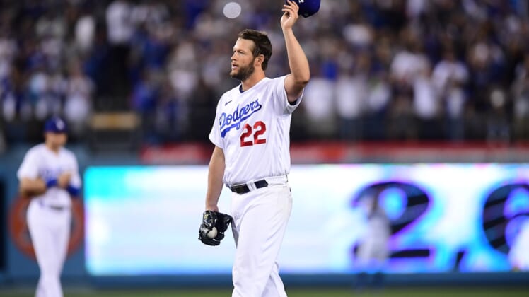 Apr 30, 2022; Los Angeles, California, USA; Los Angeles Dodgers starting pitcher Clayton Kershaw (22) acknowledges fans after striking out Detroit Tigers first baseman Spencer Torkelson (20) during the fourth inning at Dodger Stadium. The strikeout is the 2,697th of Kershaw   s career and puts him above former pitcher Don Sutton for most career strikeouts all time with the Dodgers. Mandatory Credit: Gary A. Vasquez-USA TODAY Sports
