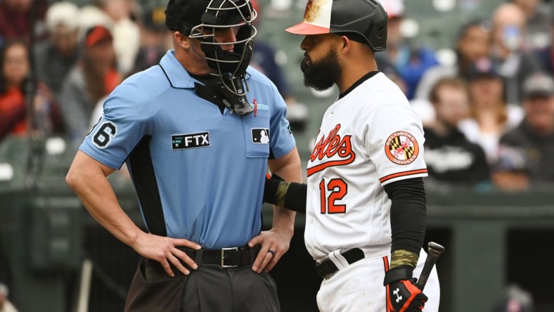 May 1, 2022; Baltimore, Maryland, USA;  Home plate umpire Ryan Blakney (36) speaks with Baltimore Orioles second baseman Rougned Odor (12) third inning at bat against the Boston Red Sox at Oriole Park at Camden Yards. Mandatory Credit: Tommy Gilligan-USA TODAY Sports