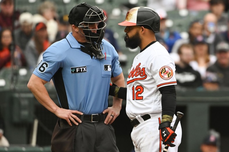 May 1, 2022; Baltimore, Maryland, USA;  Home plate umpire Ryan Blakney (36) speaks with Baltimore Orioles second baseman Rougned Odor (12) third inning at bat against the Boston Red Sox at Oriole Park at Camden Yards. Mandatory Credit: Tommy Gilligan-USA TODAY Sports