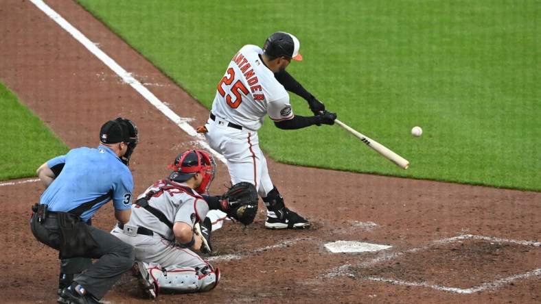 May 1, 2022; Baltimore, Maryland, USA; Baltimore Orioles right fielder Anthony Santander (25) hits a sacrifice single scoring first baseman Tyler Nevin (not pictured) during the fifth inning  at Oriole Park at Camden Yards. Mandatory Credit: Tommy Gilligan-USA TODAY Sports