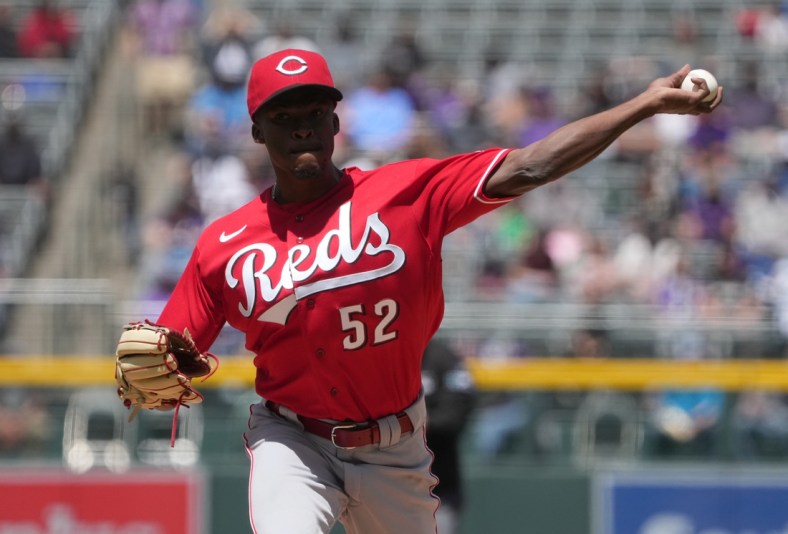 May 1, 2022; Denver, Colorado, USA; Cincinnati Reds starting pitcher Reiver Sanmartin (52) delivers a pitch in the first inning against the Colorado Rockies at Coors Field. Mandatory Credit: Ron Chenoy-USA TODAY Sports