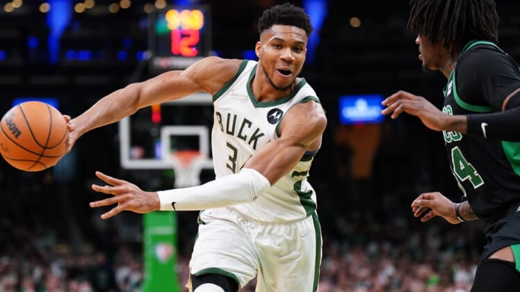 May 1, 2022; Boston, Massachusetts, USA; Milwaukee Bucks forward Giannis Antetokounmpo (34) passes the ball against Boston Celtics center Robert Williams III (44) in the second half during game one of the second round for the 2022 NBA playoffs at TD Garden. Mandatory Credit: David Butler II-USA TODAY Sports