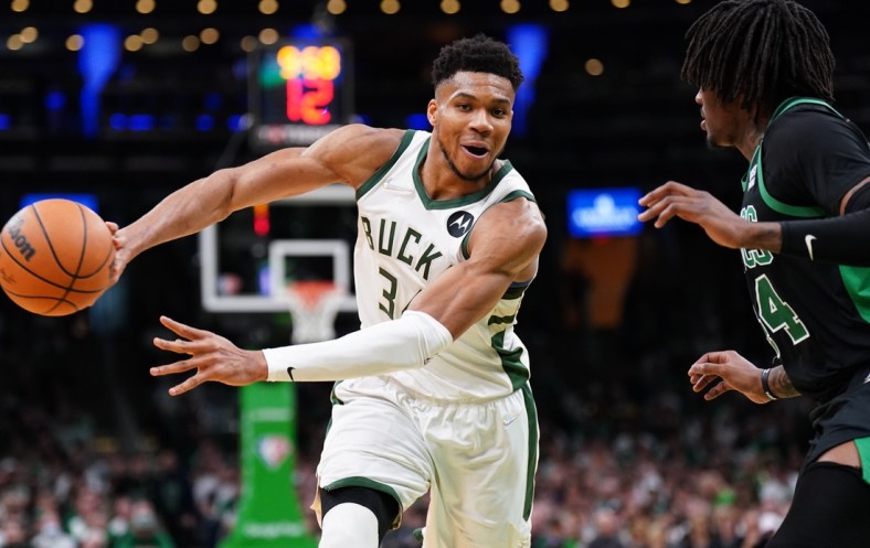May 1, 2022; Boston, Massachusetts, USA; Milwaukee Bucks forward Giannis Antetokounmpo (34) passes the ball against Boston Celtics center Robert Williams III (44) in the second half during game one of the second round for the 2022 NBA playoffs at TD Garden. Mandatory Credit: David Butler II-USA TODAY Sports