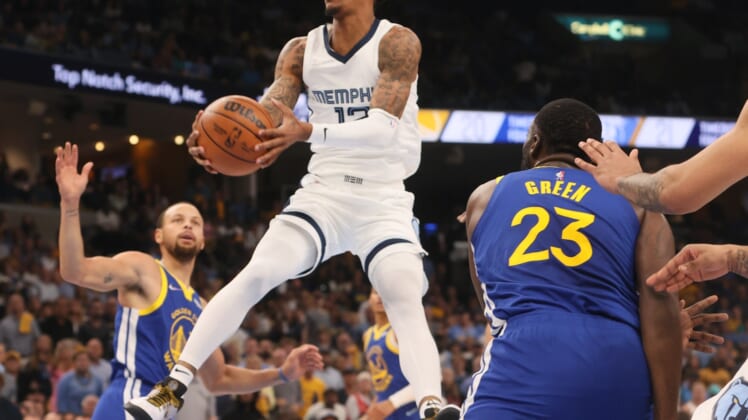 May 1, 2022; Memphis, Tennessee, USA; Memphis Grizzlies guard Ja Morant (12) attempts a layup against the Golden State Warriors during Game 1 of the second round for the 2022 NBA playoffs at FedExForum. Mandatory Credit: Joe Rondone-USA TODAY Sports