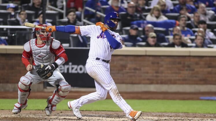 May 1, 2022; New York City, New York, USA;  New York Mets first baseman Dominic Smith (2) hits an RBI double in the fourth inning against the Philadelphia Phillies at Citi Field. Mandatory Credit: Wendell Cruz-USA TODAY Sports