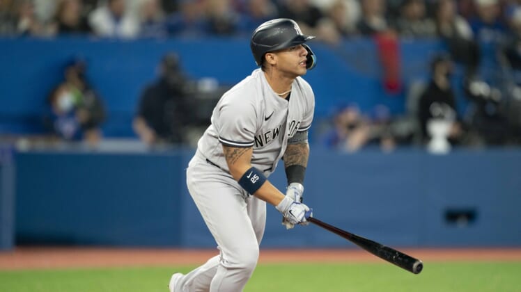 May 2, 2022; Toronto, Ontario, CAN; New York Yankees second baseman Gleyber Torres (25) hits a two run home run during the fourth inning against the Toronto Blue Jays at Rogers Centre. Mandatory Credit: Nick Turchiaro-USA TODAY Sports