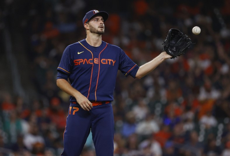 May 2, 2022; Houston, Texas, USA; Houston Astros starting pitcher Jake Odorizzi (17) reacts after a pitch during the second inning against the Seattle Mariners at Minute Maid Park. Mandatory Credit: Troy Taormina-USA TODAY Sports
