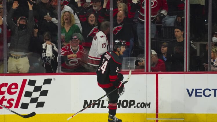 May 2, 2022; Raleigh, North Carolina, USA; Carolina Hurricanes center Seth Jarvis (24) celebrates his goal against the Boston Bruins during the second period in game one of the first round of the 2022 Stanley Cup Playoffs at PNC Arena. Mandatory Credit: James Guillory-USA TODAY Sports
