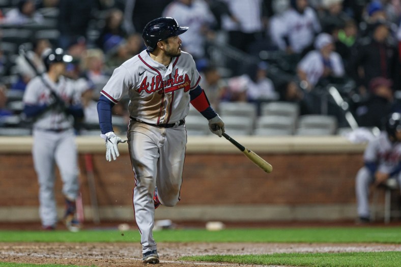 May 2, 2022; New York City, New York, USA; Atlanta Braves catcher Travis d'Arnaud (16) looks up at his two RBI double during the eighth inning against the New York Mets at Citi Field. Mandatory Credit: Vincent Carchietta-USA TODAY Sports