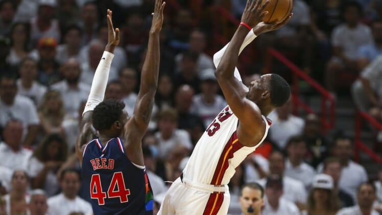 May 2, 2022; Miami, Florida, USA; Miami Heat center Bam Adebayo (13) shoots the basketball over Philadelphia 76ers forward Paul Reed (44) in the fourth quarter during game one of the second round for the 2022 NBA playoffs at FTX Arena. Mandatory Credit: Sam Navarro-USA TODAY Sports