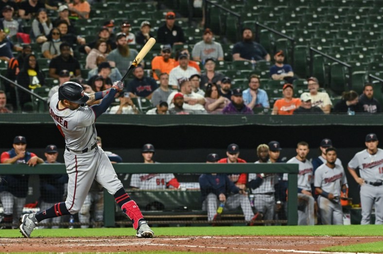 May 2, 2022; Baltimore, Maryland, USA; Minnesota Twins shortstop Carlos Correa (4) swings through rbi single scoring  designated hitter Byron Buxton (not pictured) during the sixth inning against the Baltimore Orioles  at Oriole Park at Camden Yards. Mandatory Credit: Tommy Gilligan-USA TODAY Sports