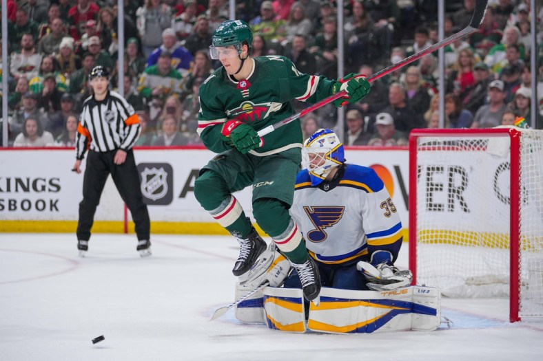 May 2, 2022; Saint Paul, Minnesota, USA; Minnesota Wild center Joel Eriksson Ek (14) screens St. Louis Blues goaltender Ville Husso (35) in the second period in game one of the first round of the 2022 Stanley Cup Playoffs at Xcel Energy Center. Mandatory Credit: Brad Rempel-USA TODAY Sports