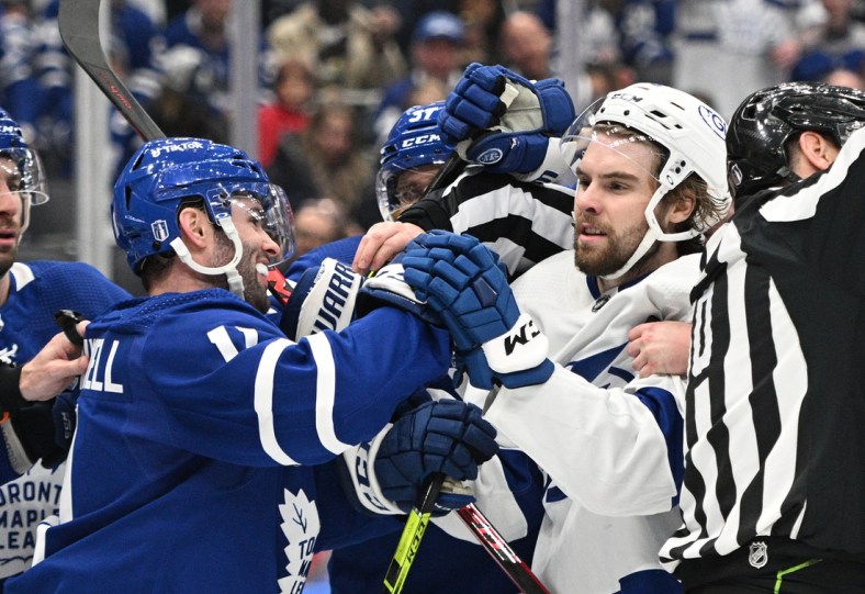 May 2, 2022; Toronto, Ontario, CAN;  Toronto Maple Leafs forward Colin Blackwell (11) pushes Tampa Bay Lightning forward Nicholas Paul (20) in game one of the first round of the 2022 Stanley Cup Playoffs at Scotiabank Arena. Mandatory Credit: Dan Hamilton-USA TODAY Sports