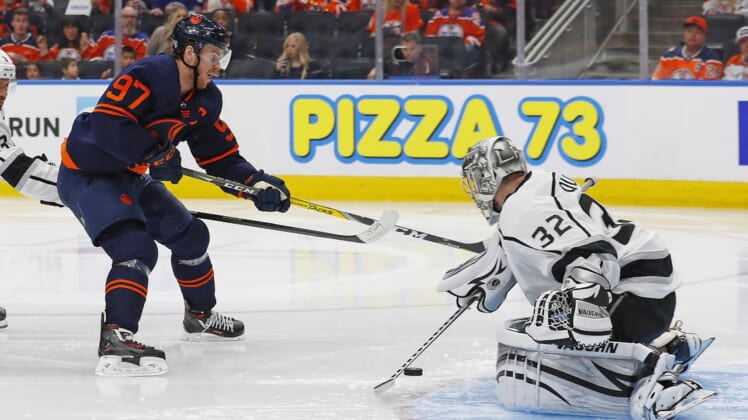 May 2, 2022; Edmonton, Alberta, CAN; Los Angeles Kings goaltender Jonathan Quick (32) makes a save on Edmonton Oilers forward Connor McDavid (97) during the third period in game one of the first round of the 2022 Stanley Cup Playoffs at Rogers Place. Mandatory Credit: Perry Nelson-USA TODAY Sports