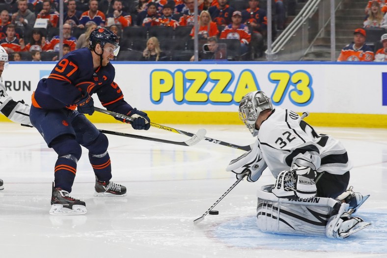 May 2, 2022; Edmonton, Alberta, CAN; Los Angeles Kings goaltender Jonathan Quick (32) makes a save on Edmonton Oilers forward Connor McDavid (97) during the third period in game one of the first round of the 2022 Stanley Cup Playoffs at Rogers Place. Mandatory Credit: Perry Nelson-USA TODAY Sports