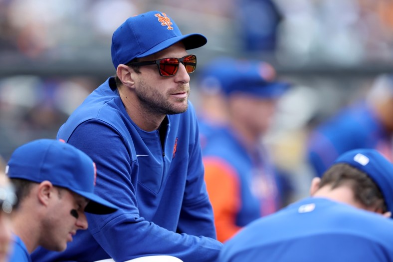 May 3, 2022; New York City, New York, USA; New York Mets starting pitcher Max Scherzer (21) watches from the dugout during the seventh inning against the Atlanta Braves at Citi Field. Mandatory Credit: Brad Penner-USA TODAY Sports