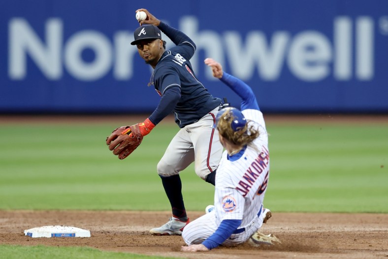 May 3, 2022; New York City, New York, USA; Atlanta Braves second baseman Ozzie Albies (1) forces out New York Mets right fielder Travis Jankowski (16) at second and throws to first to complete a double play on a ball hit by New York Mets catcher James McCann (not pictured) during the second inning at Citi Field. Mandatory Credit: Brad Penner-USA TODAY Sports