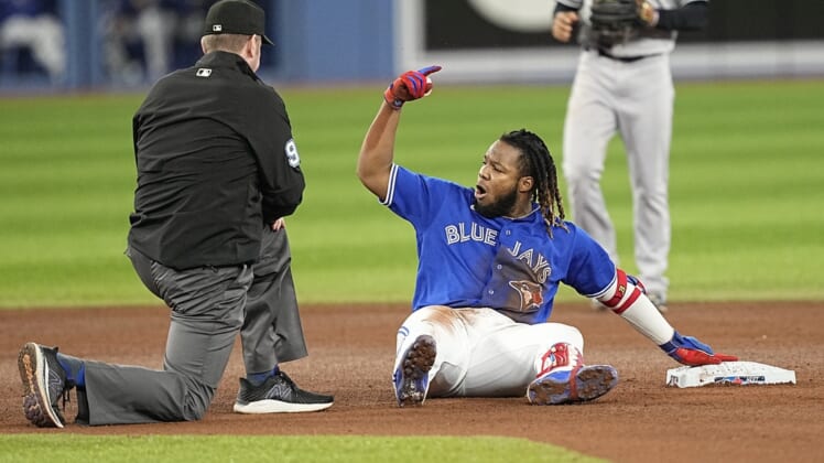May 3, 2022; Toronto, Ontario, CAN; Toronto Blue Jays first baseman Vladimir Guerrero Jr. (27) gestures to his bench after a hitting a double against the New York Yankees during the fourth inning at Rogers Centre. Mandatory Credit: John E. Sokolowski-USA TODAY Sports
