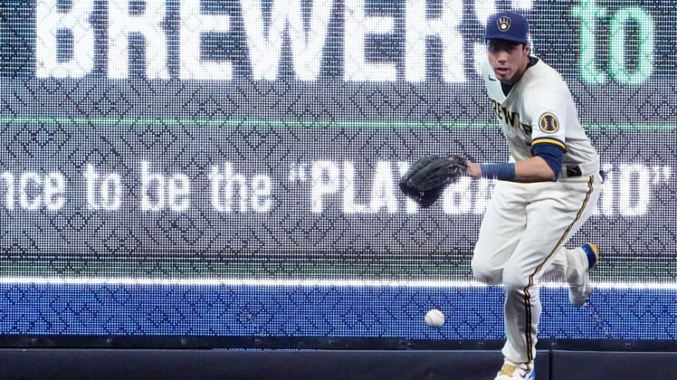 Milwaukee Brewers left fielder Christian Yelich (22) feels a double hit by Cincinnati Reds left fielder Tommy Pham (28) during the first inning of their game May 3, 2022 at American Family Field in Milwaukee, Wis.Brewers04 5
