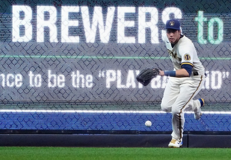 Milwaukee Brewers left fielder Christian Yelich (22) feels a double hit by Cincinnati Reds left fielder Tommy Pham (28) during the first inning of their game May 3, 2022 at American Family Field in Milwaukee, Wis.

Brewers04 5