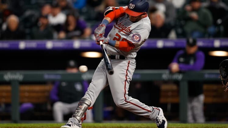 May 3, 2022; Denver, Colorado, USA; Washington Nationals left fielder Yadiel Hernandez (29) hits a single in the fifth inning against the Colorado Rockies at Coors Field. Mandatory Credit: Isaiah J. Downing-USA TODAY Sports
