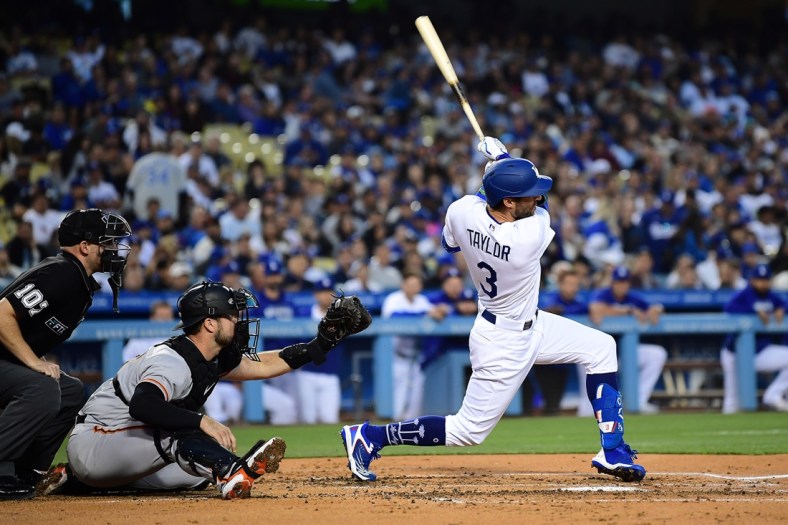 May 3, 2022; Los Angeles, California, USA; Los Angeles Dodgers left fielder Chris Taylor (3) hits a two run RBI single against the San Francisco Giants during the second inning at Dodger Stadium. Mandatory Credit: Gary A. Vasquez-USA TODAY Sports