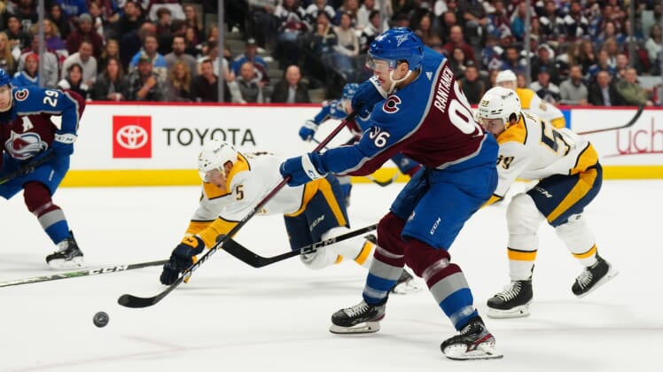 May 3, 2022; Denver, Colorado, USA; Colorado Avalanche right wing Mikko Rantanen (96) shoots the puck in the second period of game one against the Nashville Predators of the first round of the 2022 Stanley Cup Playoffs at Ball Arena. Mandatory Credit: Ron Chenoy-USA TODAY Sports