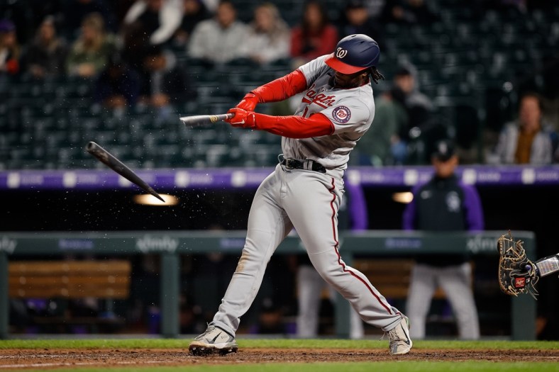 May 3, 2022; Denver, Colorado, USA; Washington Nationals first baseman Josh Bell (19) shatters his bat on a single in the ninth inning against the Colorado Rockies at Coors Field. Mandatory Credit: Isaiah J. Downing-USA TODAY Sports